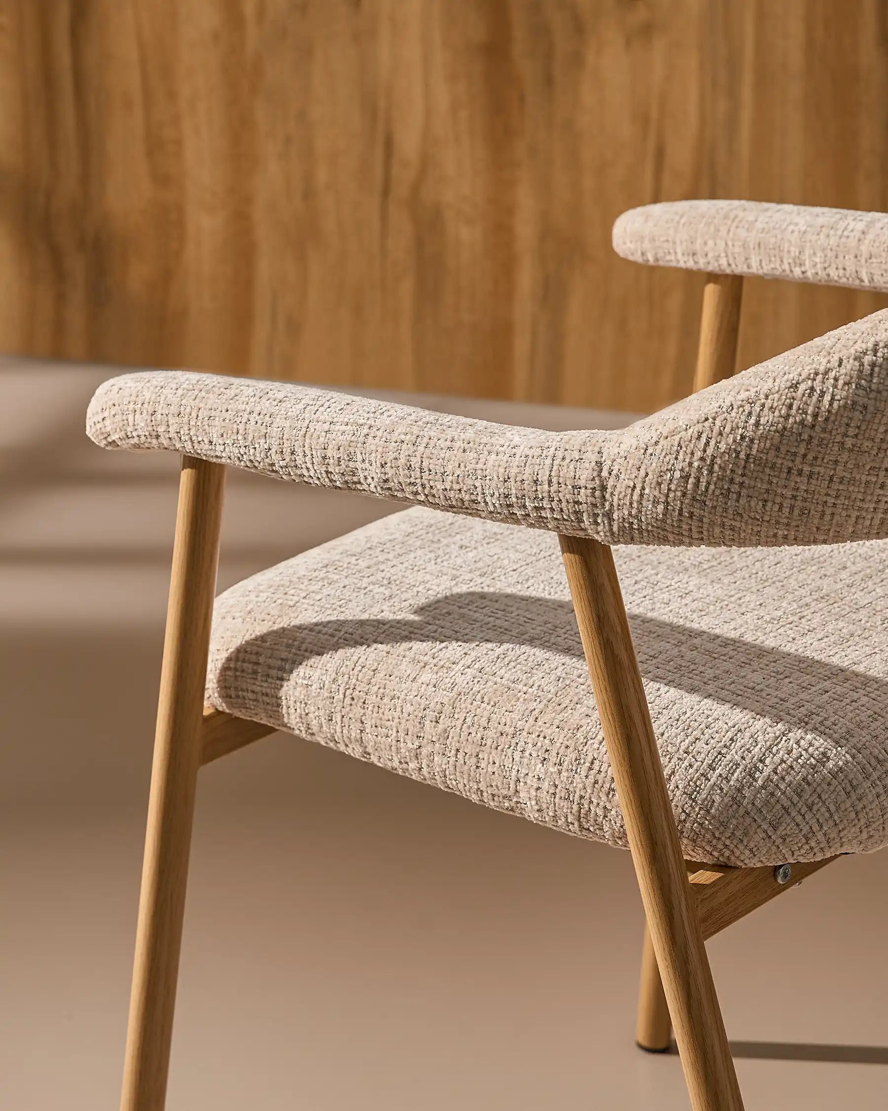 Side view of Arlo chenille dining chairs with oak-effect legs