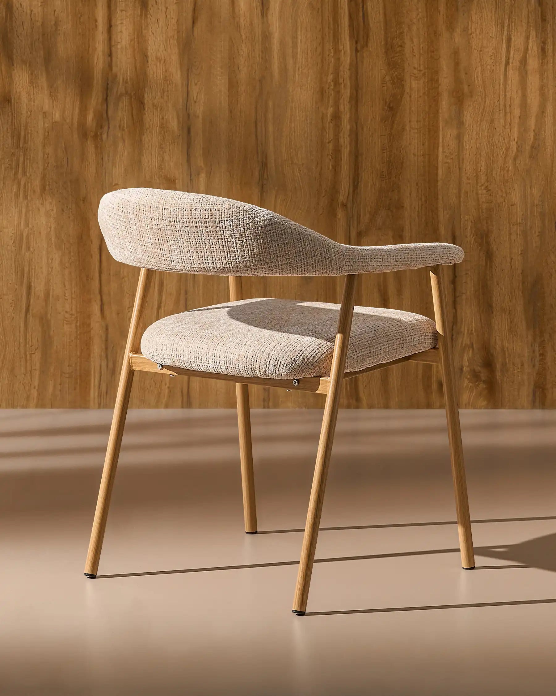 Side view of Arlo chenille dining chairs with oak-effect legs