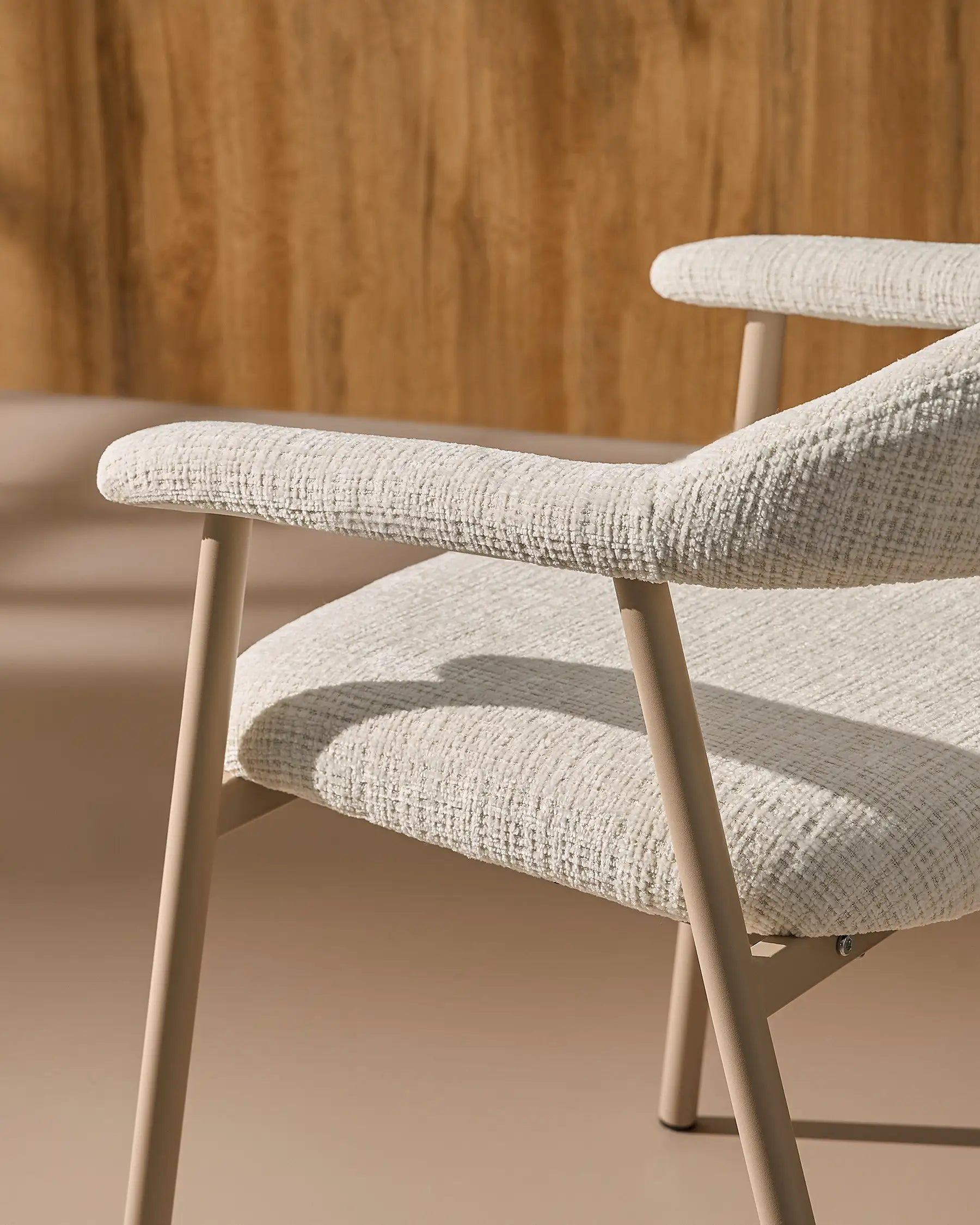 Side view of Arlo White chenille dining chairs with taupe legs