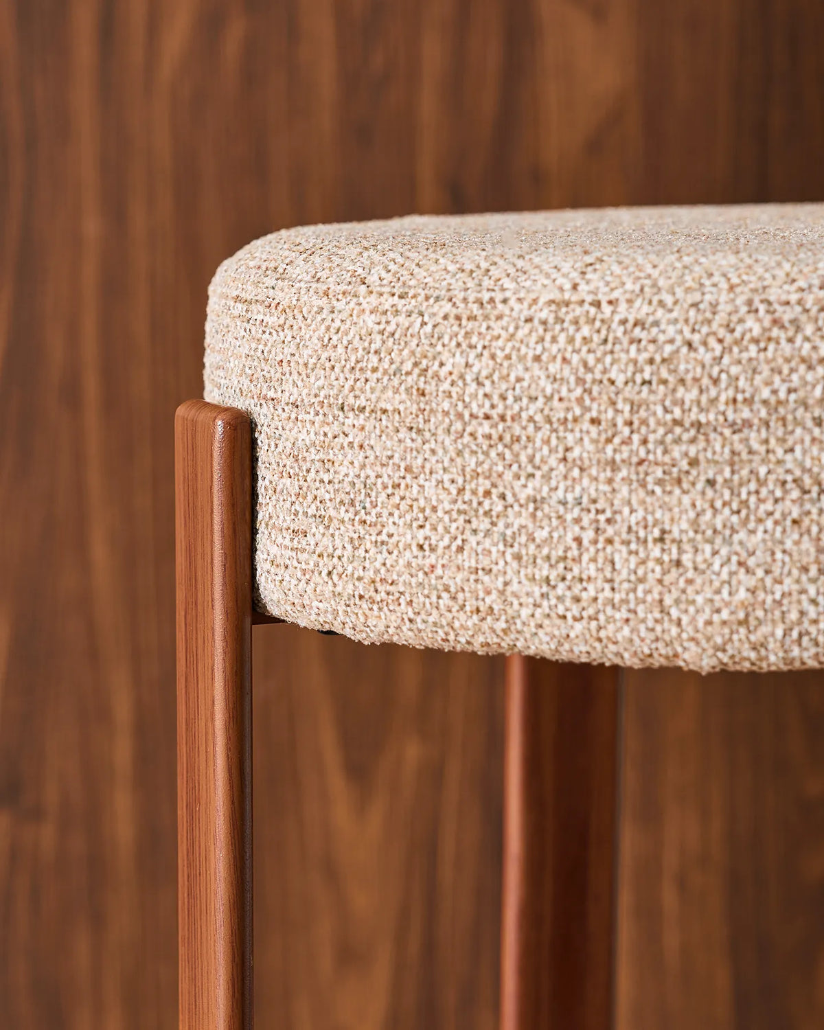 Close-up of the round seat with soft light taupe chenille upholstery