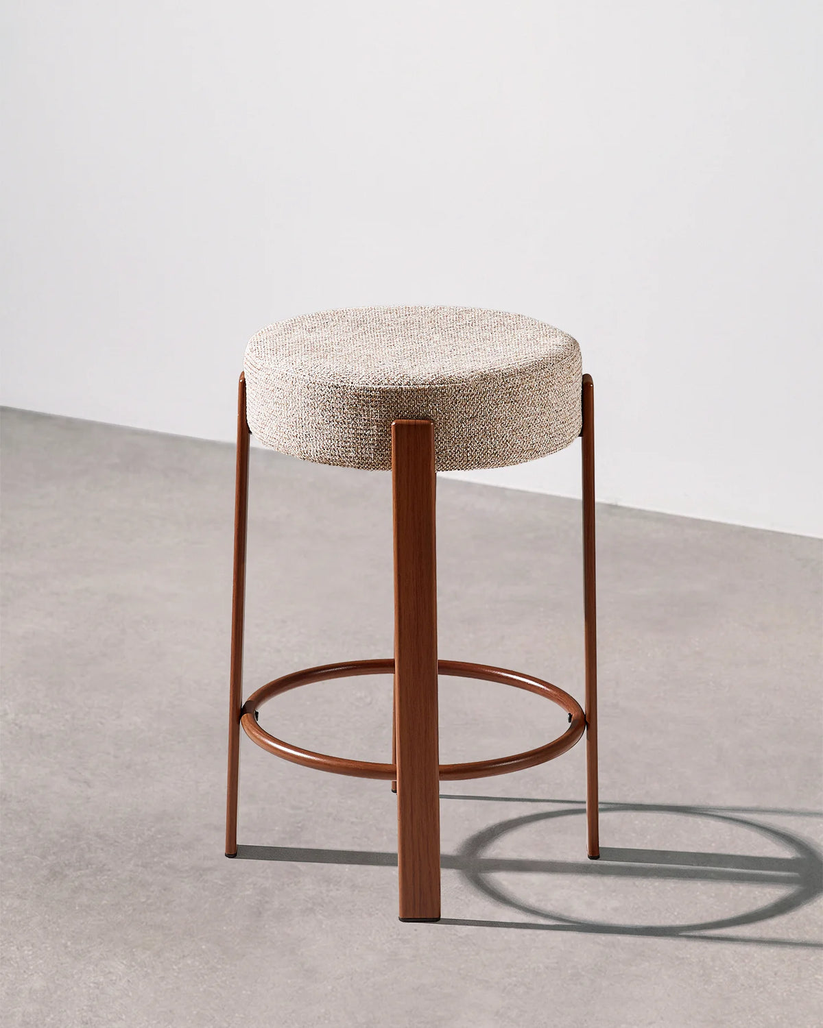 Bramley light taupe chenille bar stool with a round upholstered seat and integrated footrest