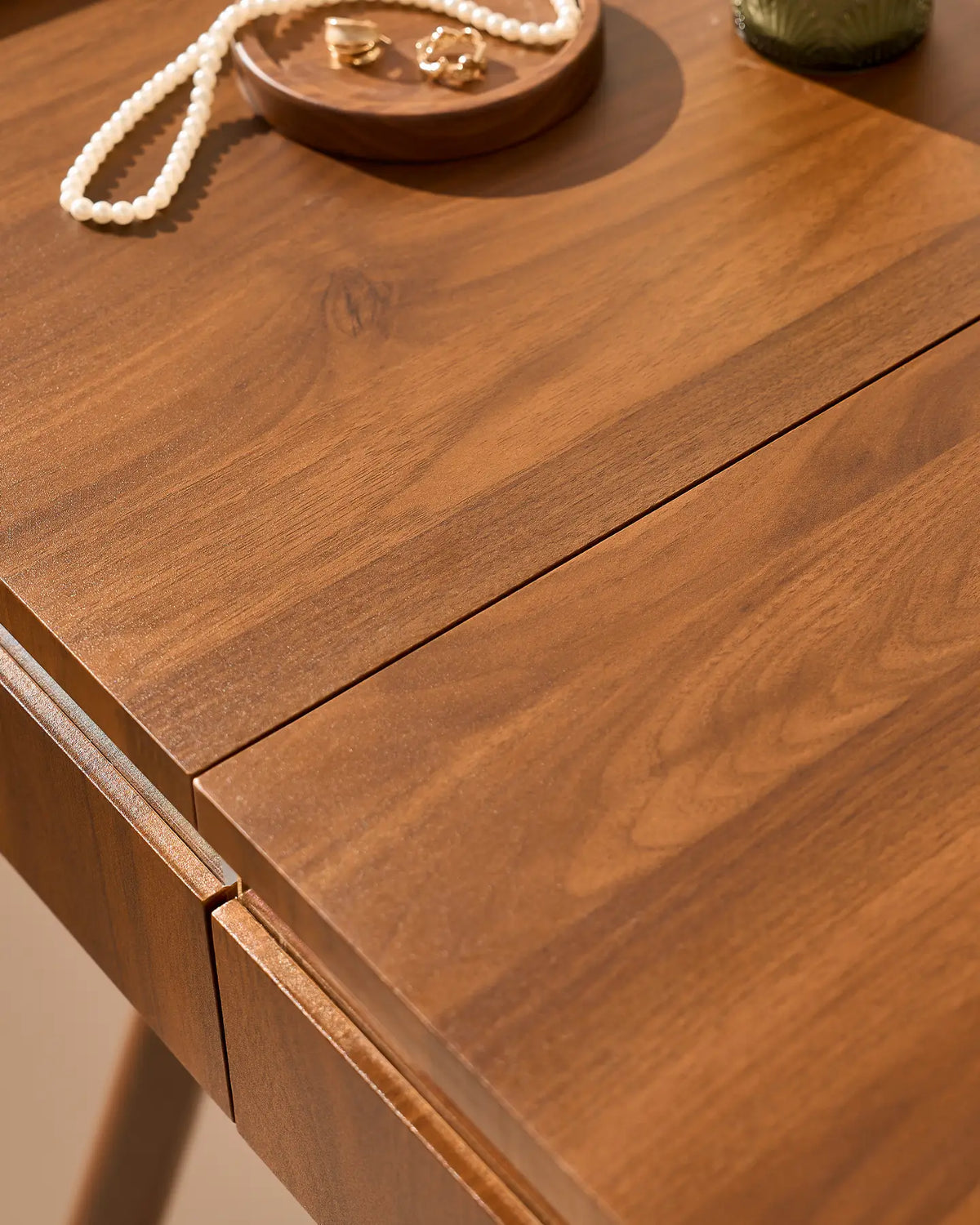Close-up of the warm walnut-effect finish on the Elora dressing table
