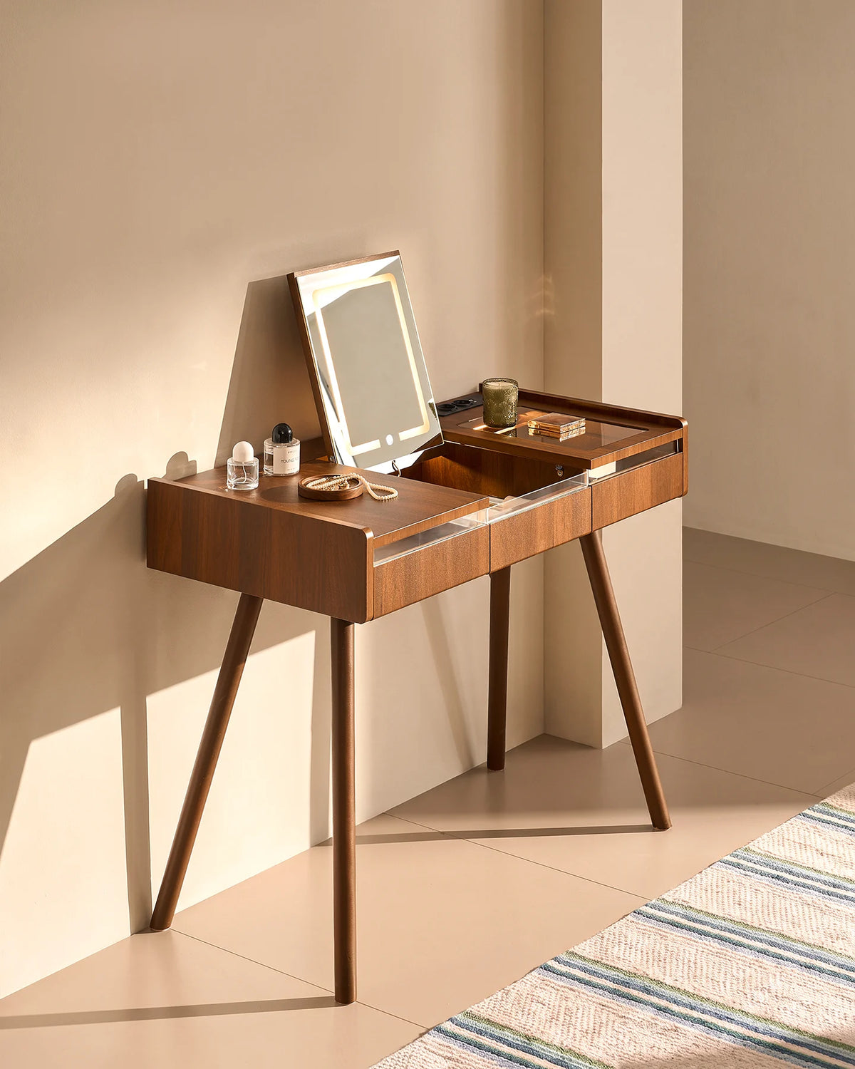 Elora dressing table with illuminated flip-top mirror styled with everyday beauty essentials