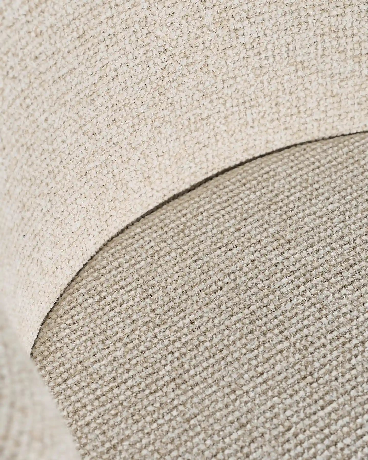 Close-up of cream chenille upholstery on Nolan dining chairs