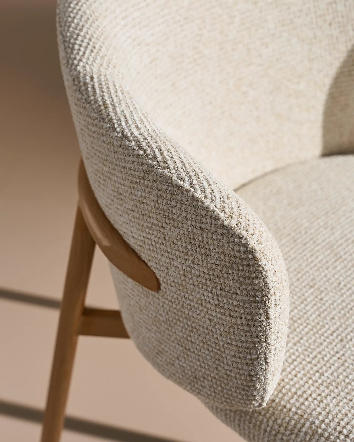 Close-up of cream chenille upholstery on Nolan dining chairs