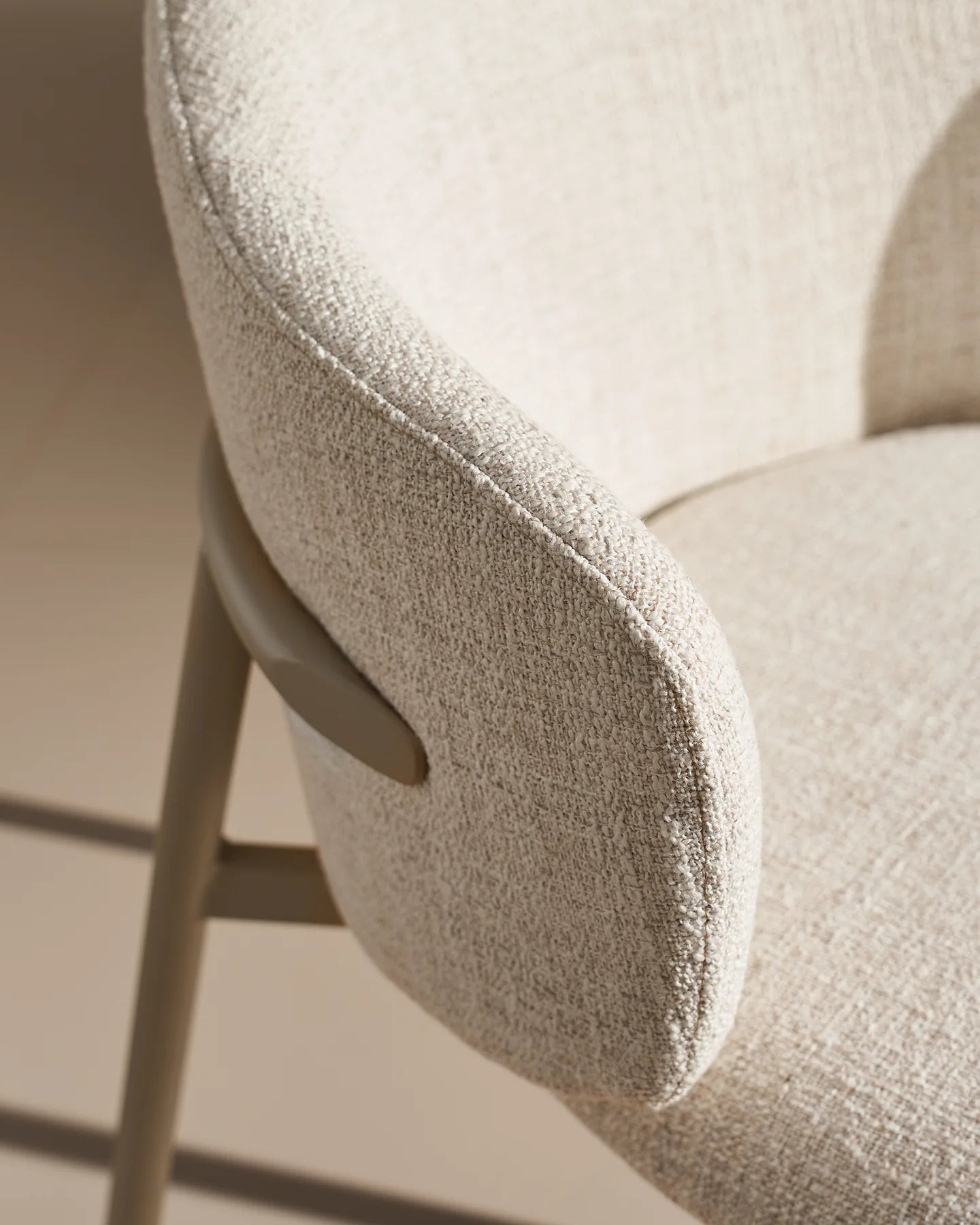 Close-up of ivory linen blend upholstery on Nolan dining chairs