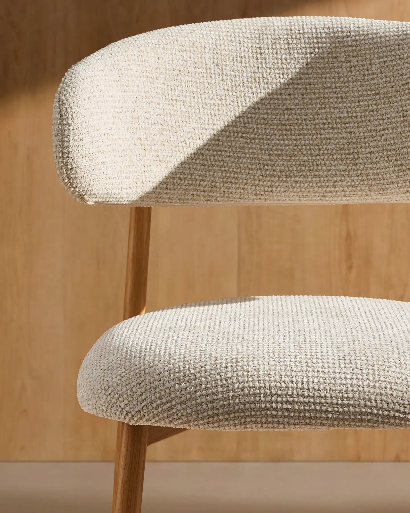 Close-up of cream chenille upholstery on Rowan bar stools