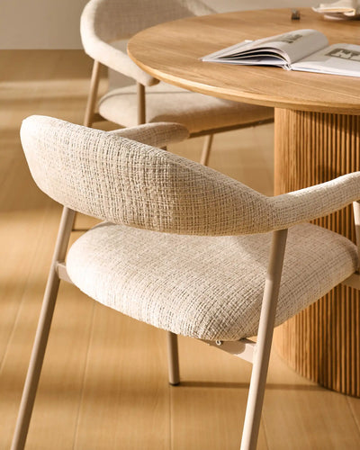 Side view of Arlo Beige chenille dining chairs with taupe legs