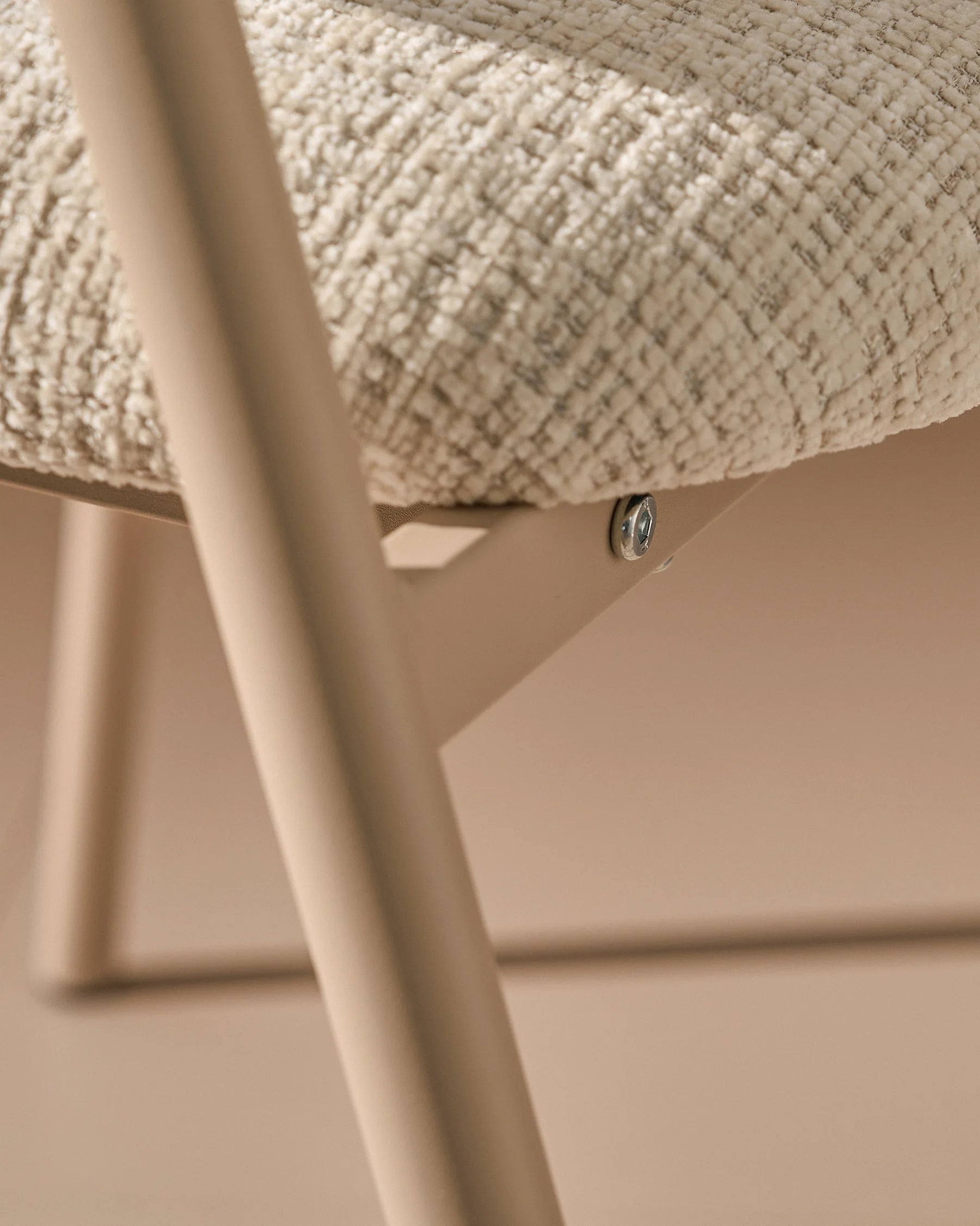 Close-up of chenille upholstery and taupe legs on Arlo Beige dining chairs