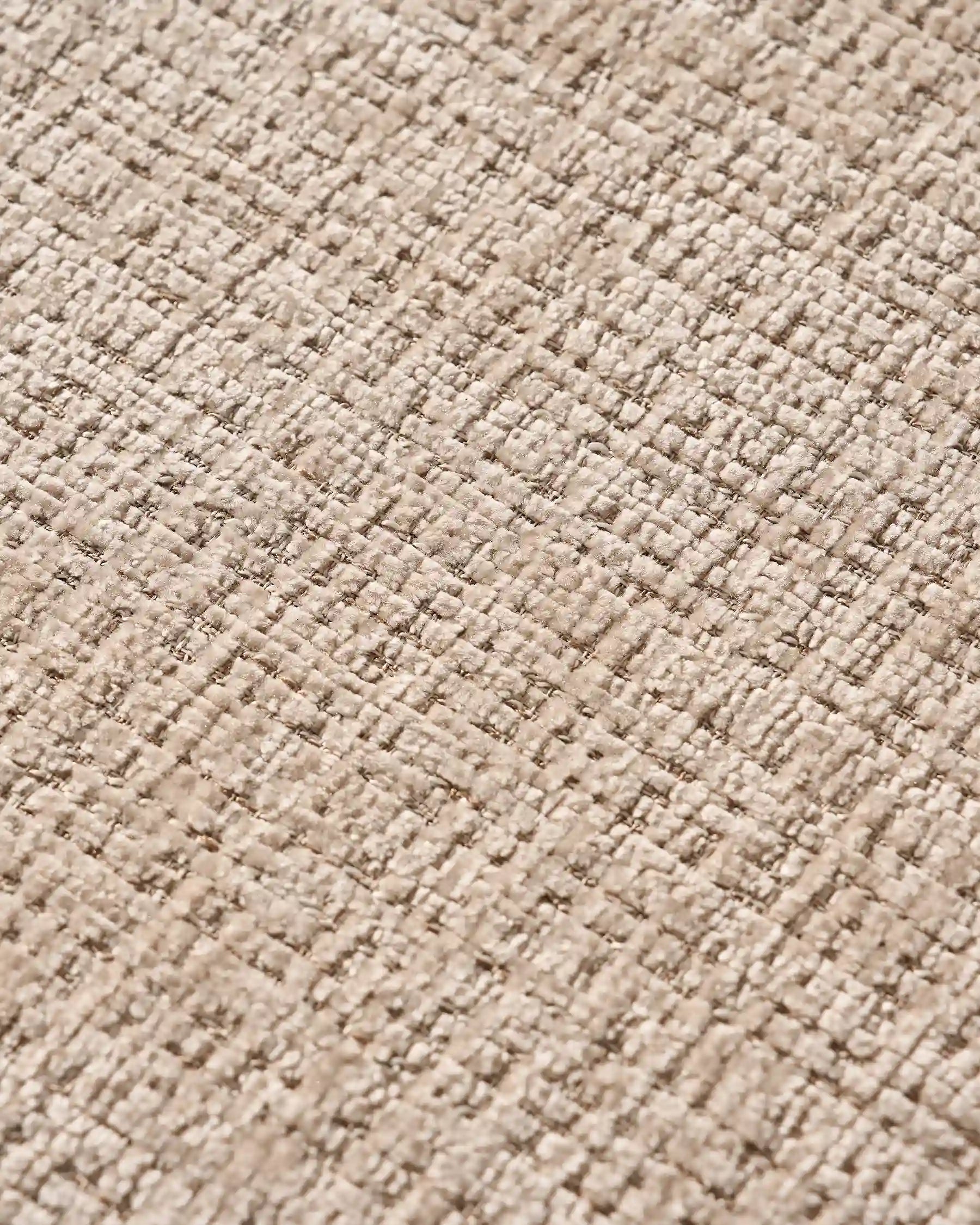 Close-up of chenille upholstery and oak-effect legs on Arlo dining chairs
