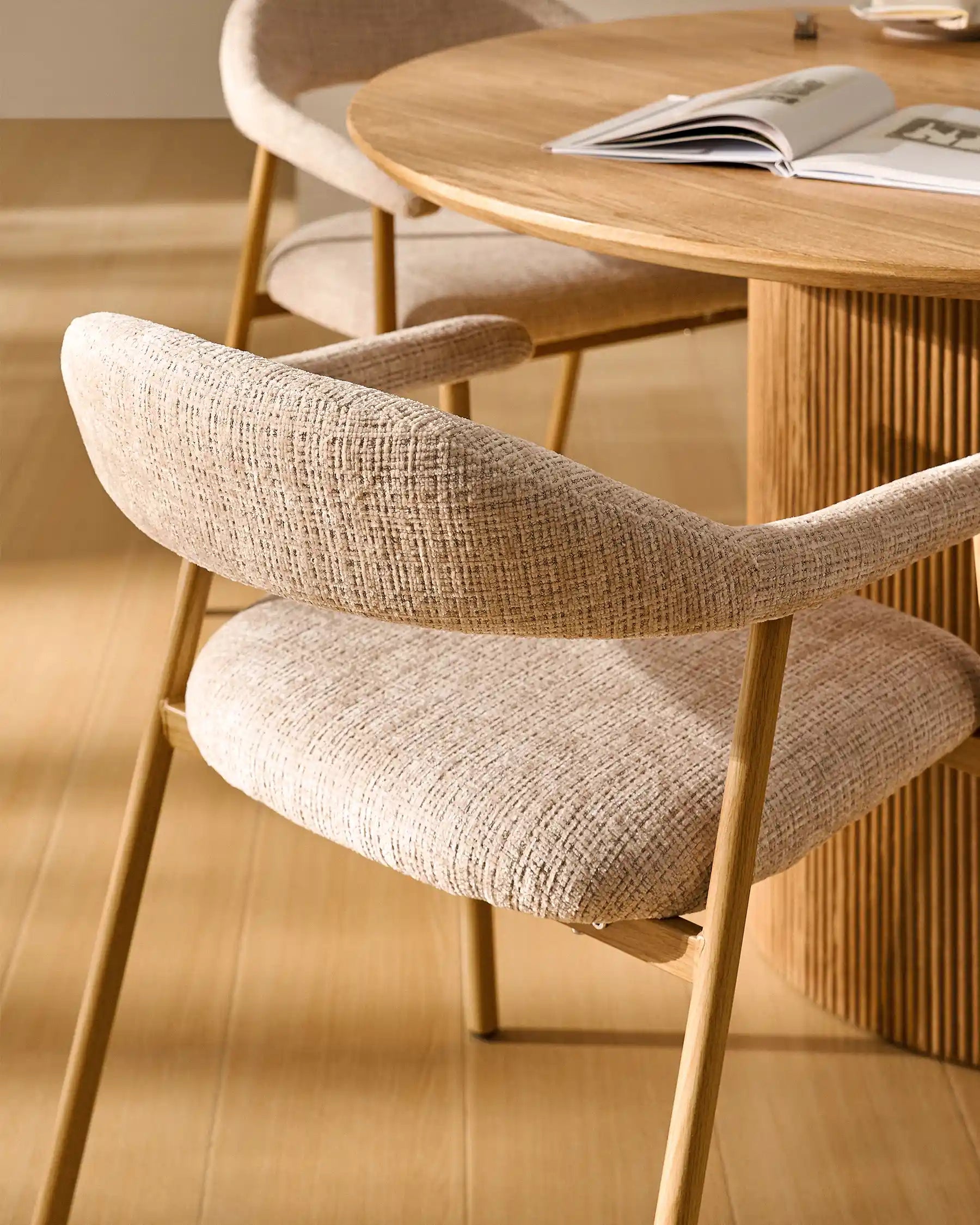 Side view of Arlo chenille dining chairs with oak-effect legs