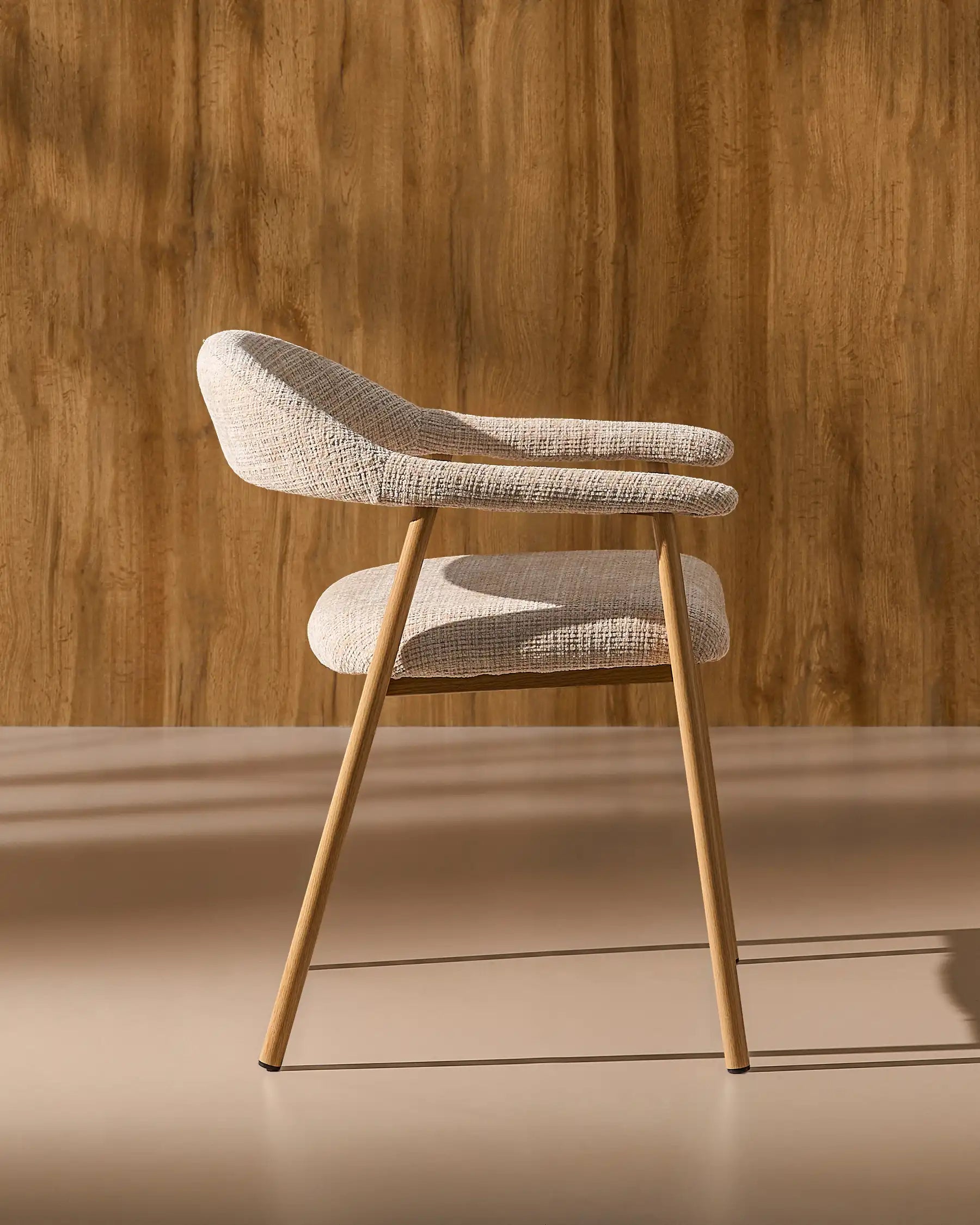 Side view of Arlo chenille dining chairs with oak-effect legs