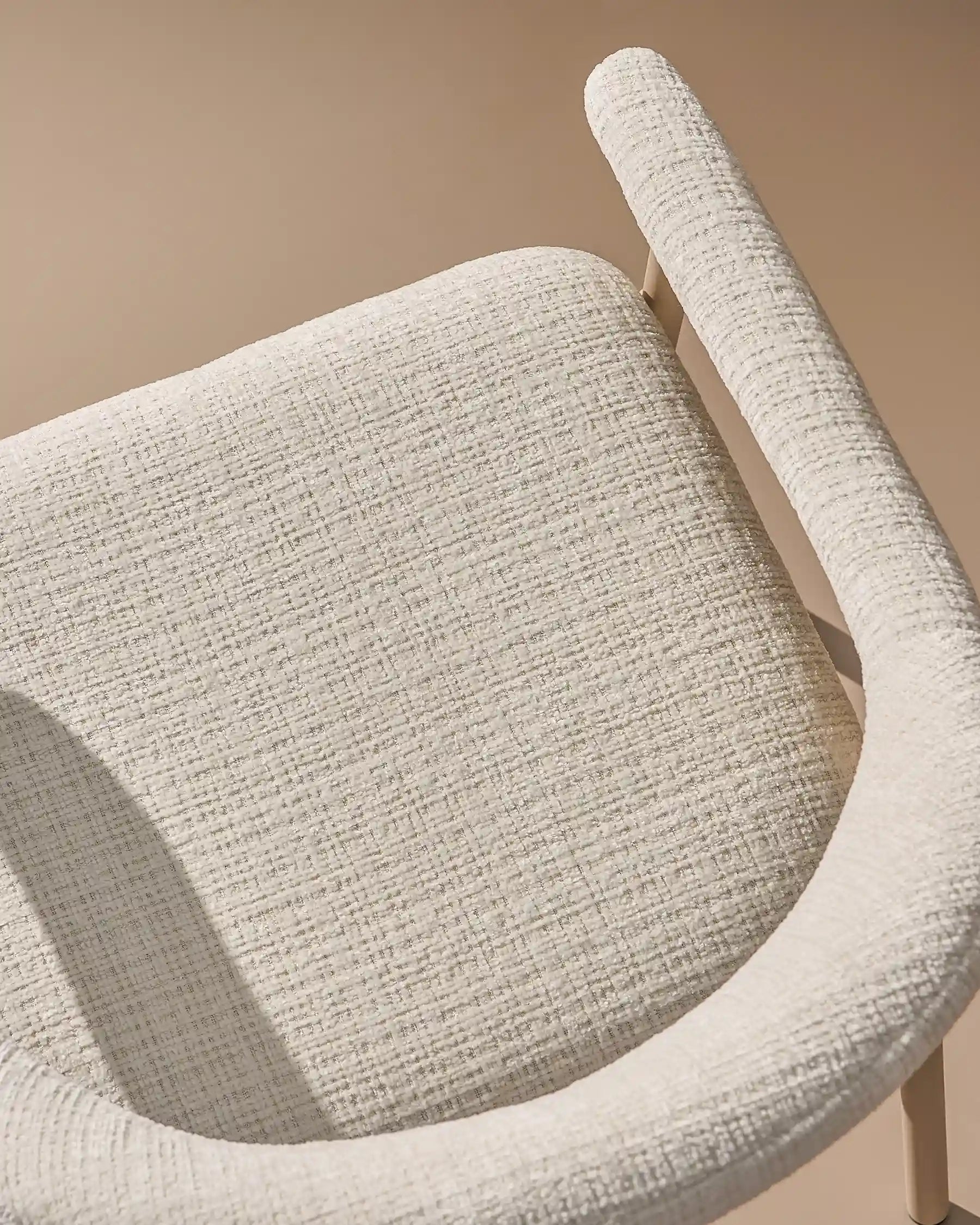 Close-up of chenille upholstery and taupe legs on Arlo White dining chairs -1