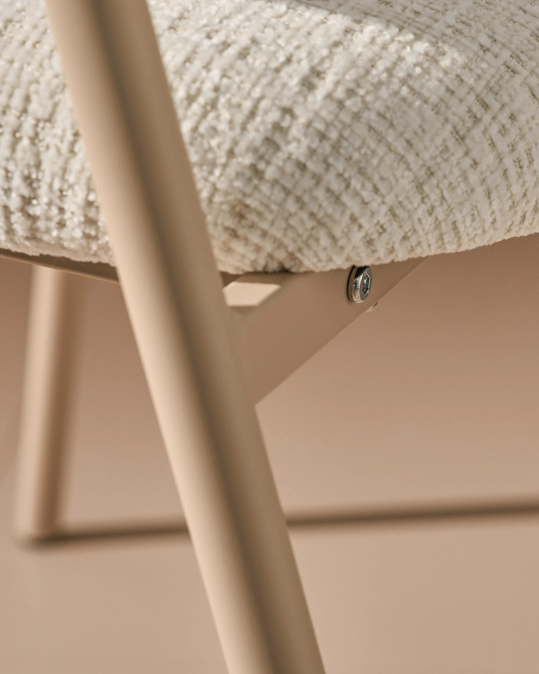 Close-up of chenille upholstery and taupe legs on Arlo White dining chairs