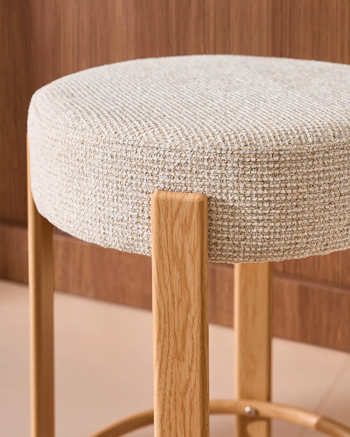 Close-up of the round seat with soft beige chenille upholstery
