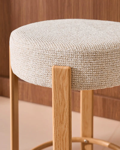 Close-up of the round seat with soft beige chenille upholstery