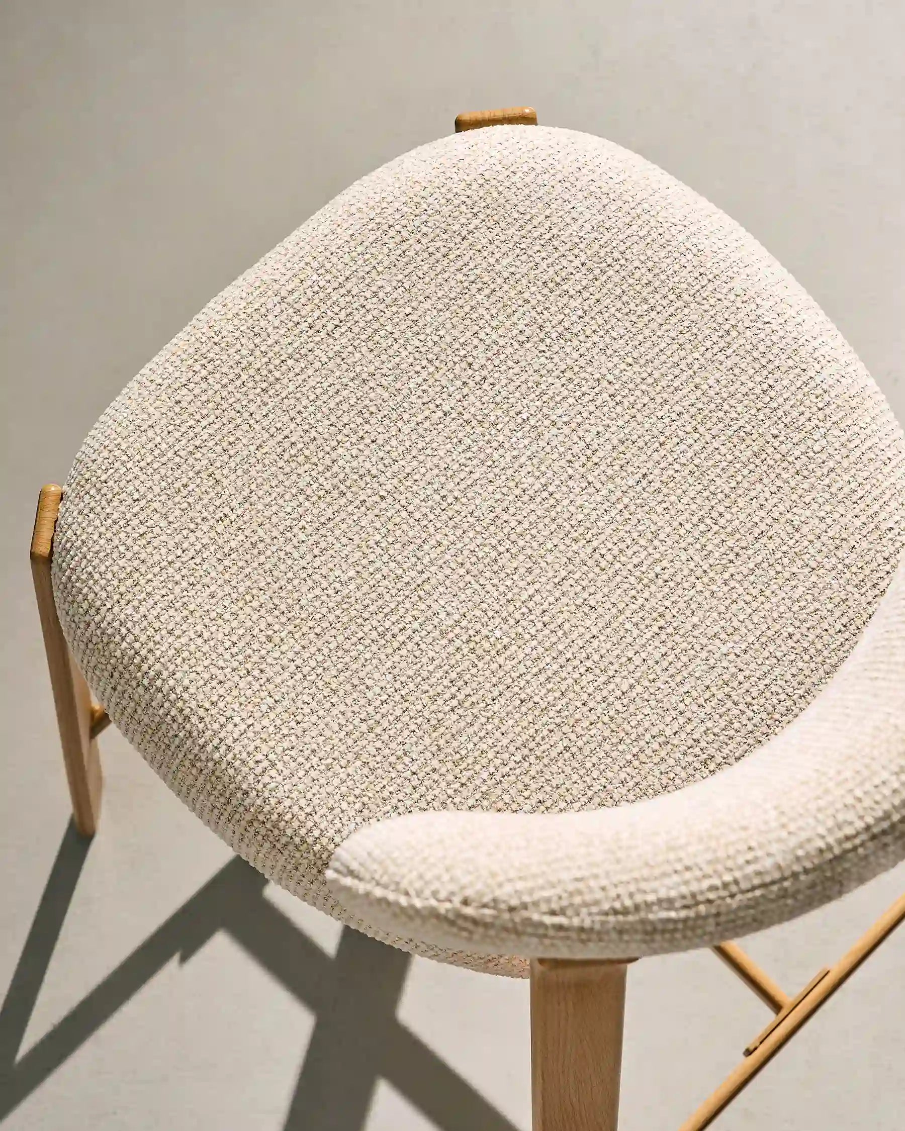 Close-up of beige chenille upholstery on Bramley bar stools