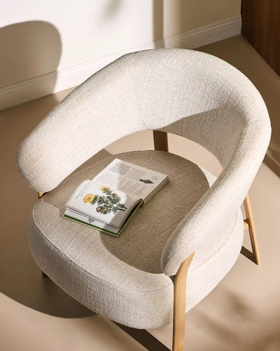 Bramley cream linen blend accent chair in a modern living space