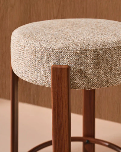 Close-up of the round seat with soft light taupe chenille upholstery
