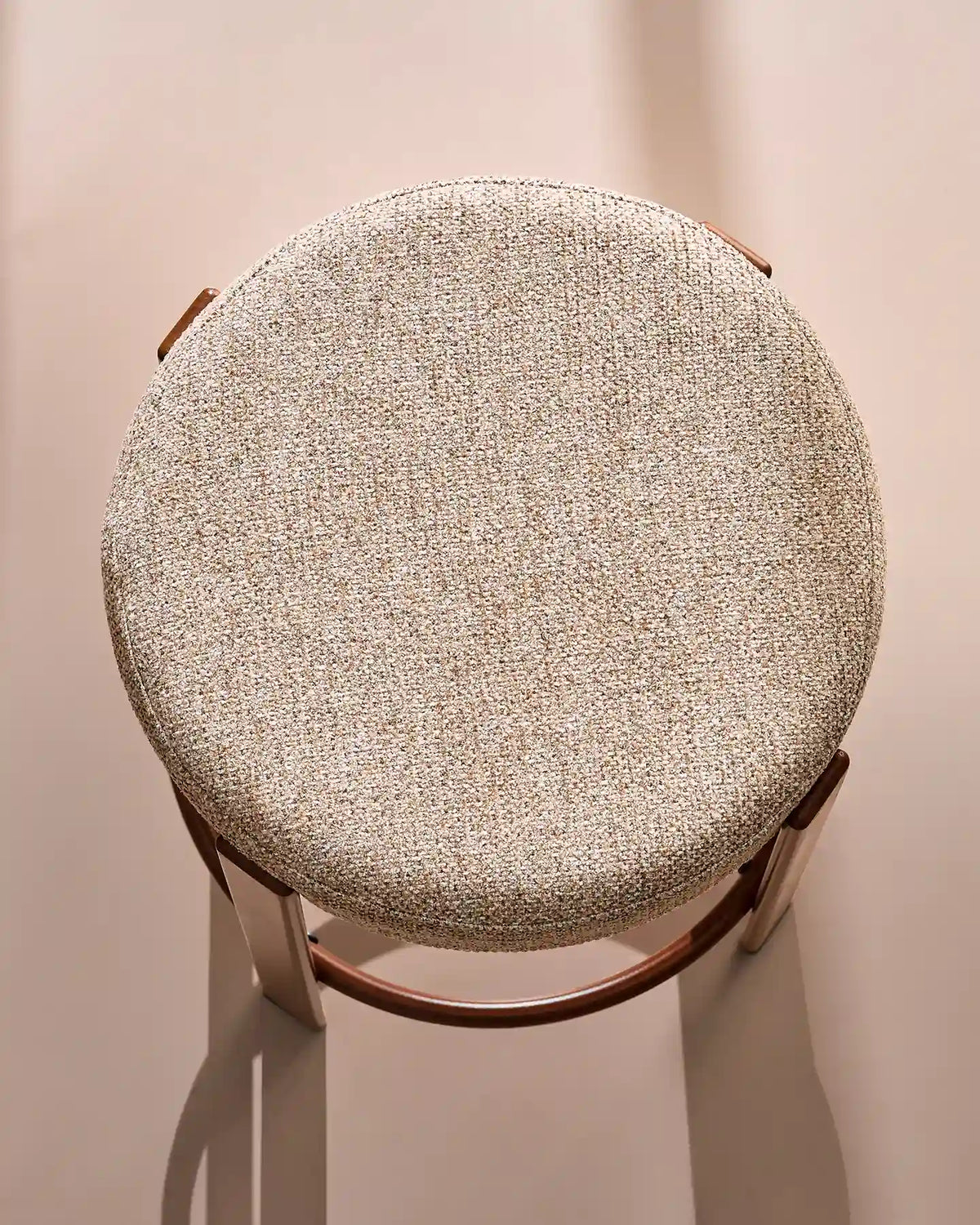 Close-up of the round seat with soft light taupe chenille upholstery