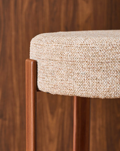 Close-up of the round seat with soft light taupe chenille upholstery