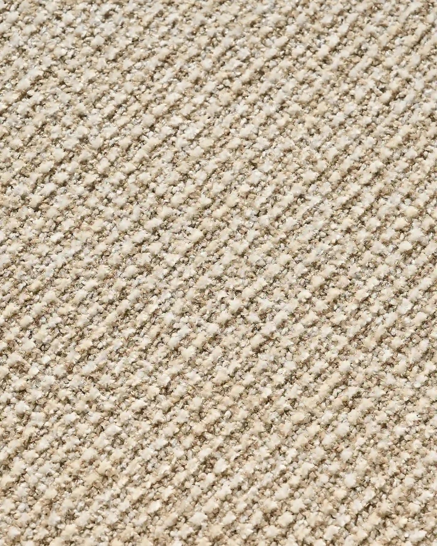 Close-up of beige chenille upholstery on Elowen dining chairs