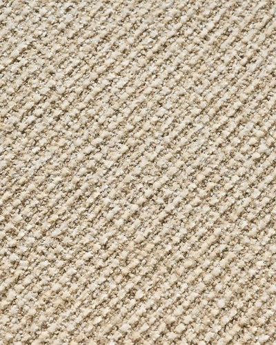 Close-up of beige chenille upholstery on Elowen dining chairs