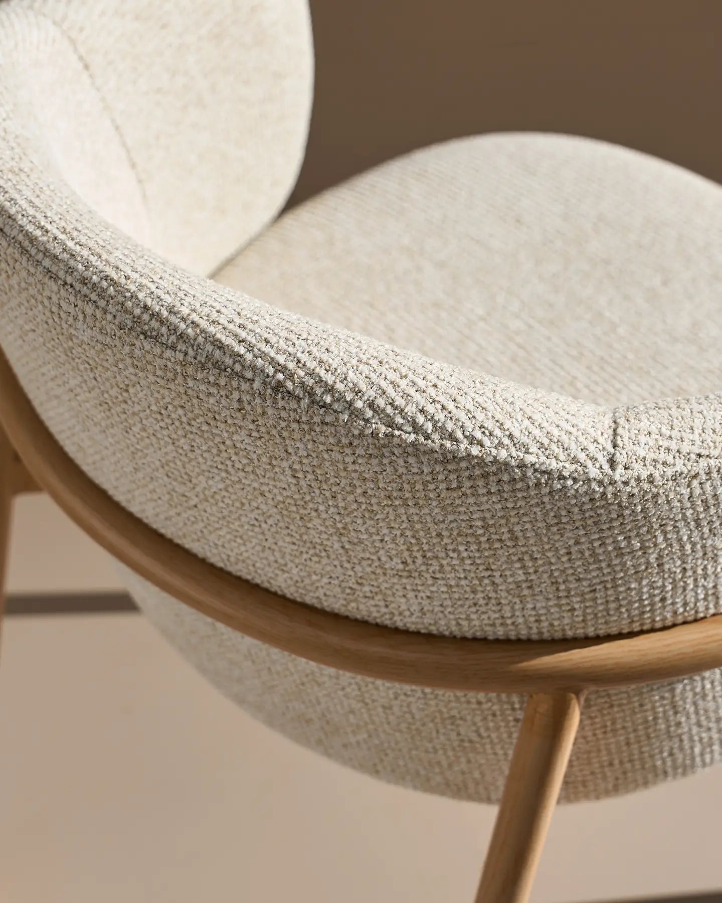 Close-up of cream chenille upholstery on Nolan dining chairs