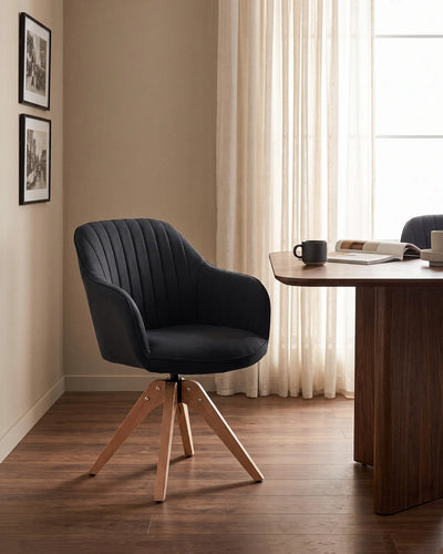 Oakley Black Linen Blend Swivel Chair Around a Modern Dining Table